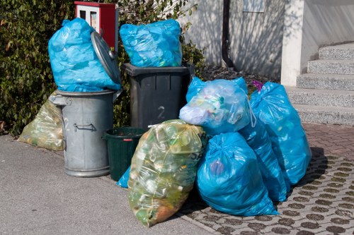 Waste clearance truck on a residential street in Ickenham